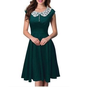 Retro style emerald green dress with Peter Pan collar